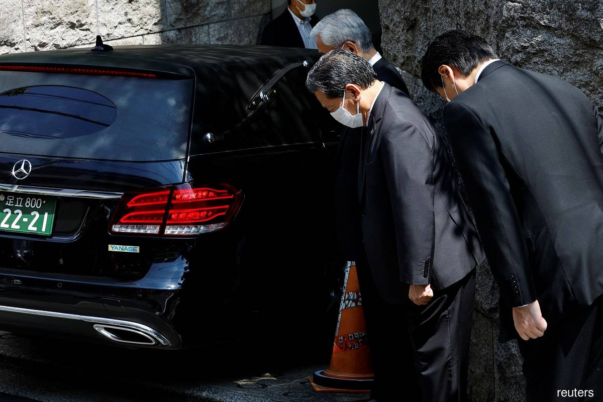 Body of former Japanese PM Abe arrives in Tokyo